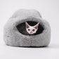 White cat resting inside a gray wool cat cave bed | Natural, non‑toxic pet nest for cats and small dogs | Cozy, handmade pet furniture